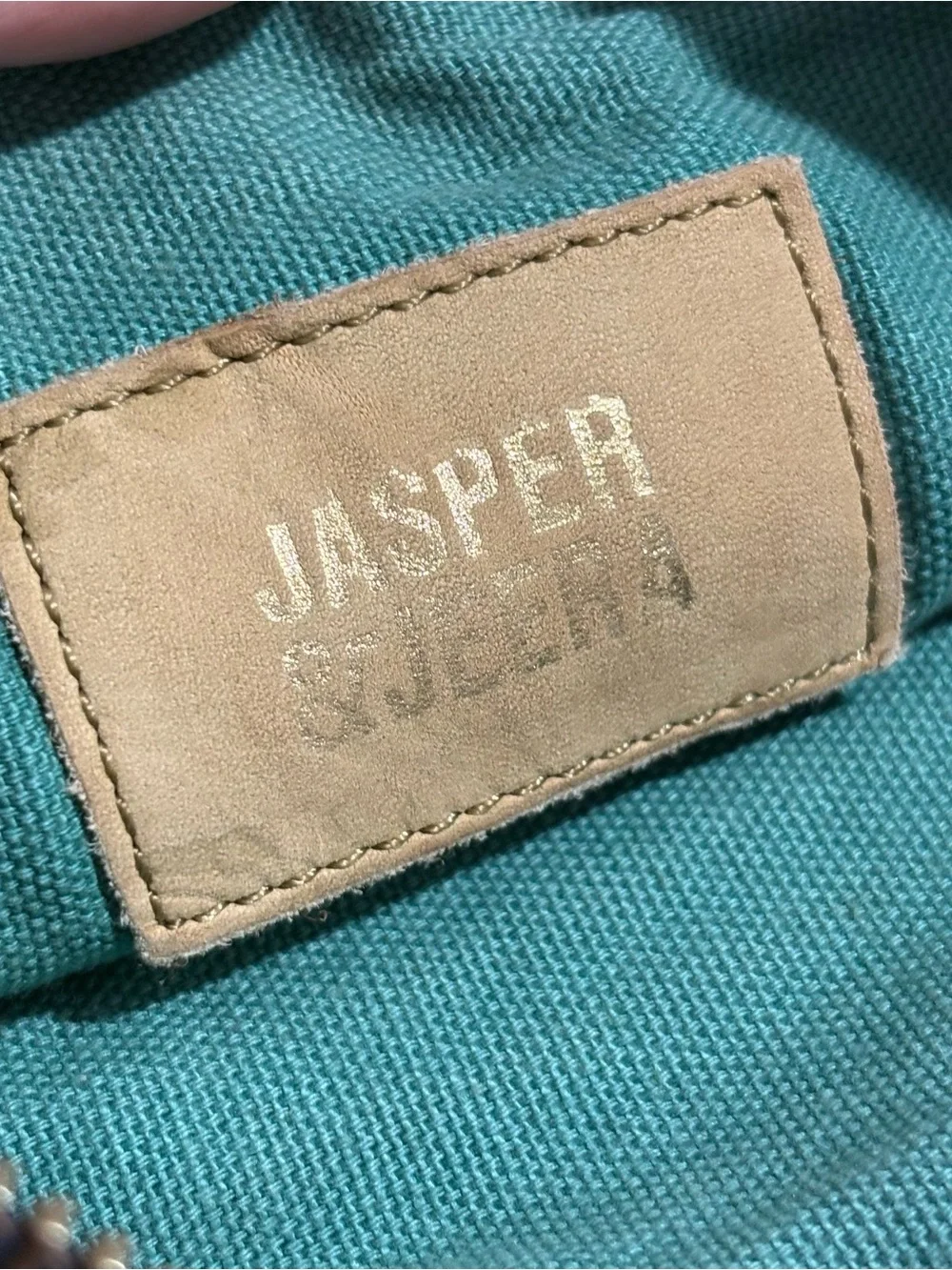 Jasper & Jeera navy/aqua striped stitch-work zipper pouch wristlet